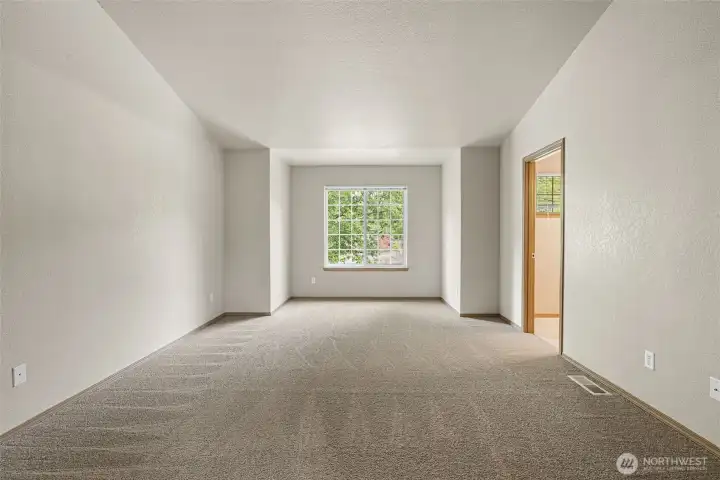 Brand new carpet throughout the home and great natural light in this primary bedroom, make it a perfect retreat spot