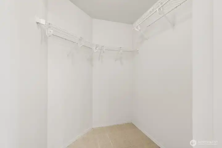 Primary bedroom walk-in closet.