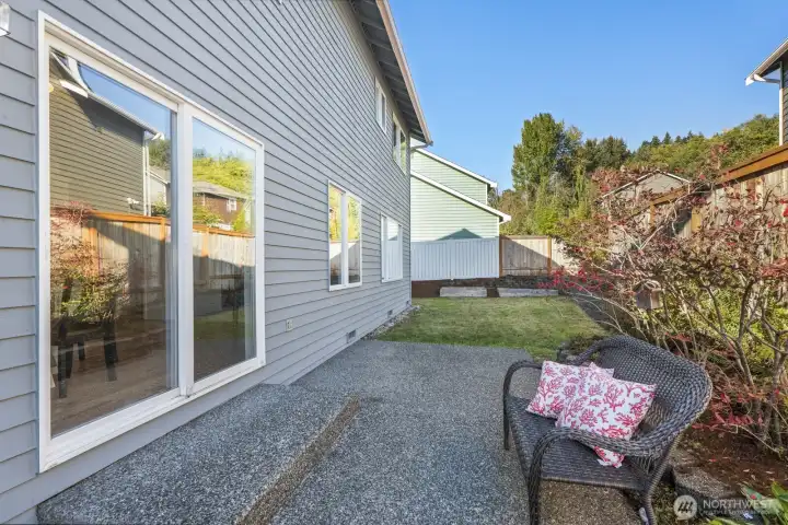 Fully fenced backyard with patio and lots of garden and/or play area.