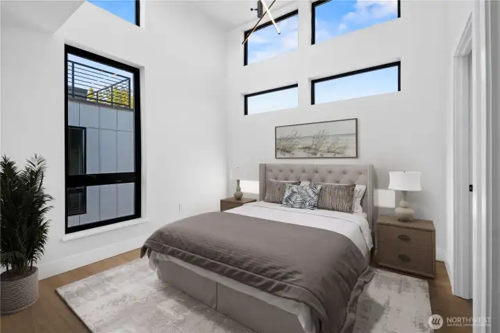 Upper Level Primary Suite.  Photo has been virtually staged and may be an angle from an adjacent unit.