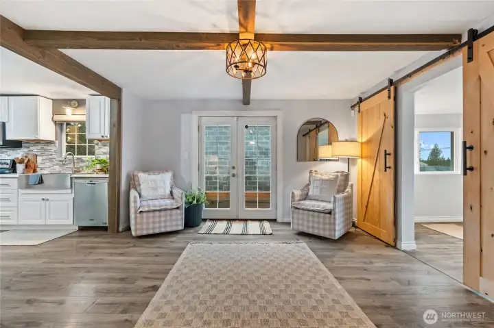 Cozy living area with brand-new windows throughout the home.
