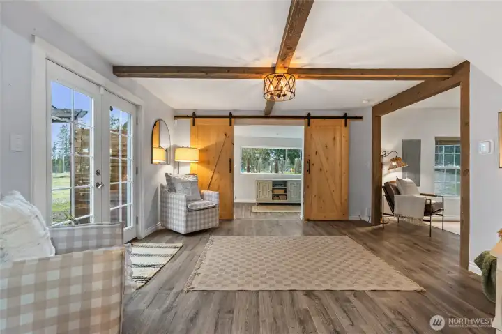 Another view of the living room with LVP flooring throughout.