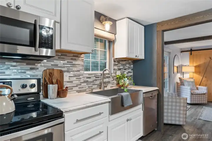 Inviting kitchen perfect for gatherings, with stainless steel appliances.