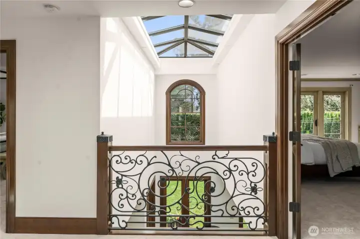 A dramatic linear skylight spanning the length of the home, complete with integrated shading that filters soft natural light throughout.