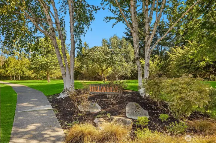 At the entrance to Hillandale is a stately sign with a pond to the right and open space trails.