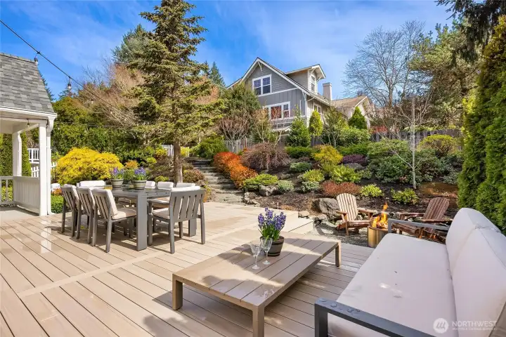 This shows a sunken area with pea gravel suitable for a fire pit gathering area. (this outdoor furniture does not convey).
