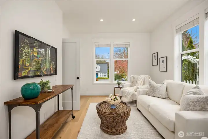 Just inside the entry and to the left is this bright room formerly used as an office/guest room as it is adjacent the powder room, but now staged as a cozy TV room.
