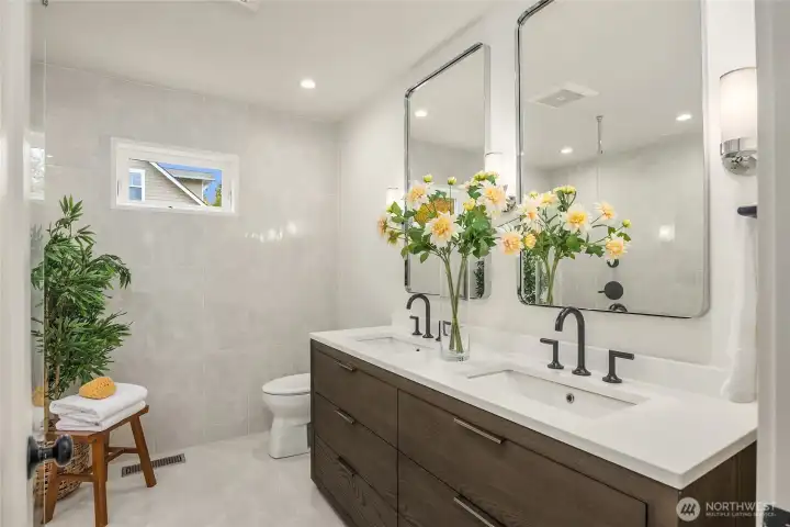 Such a spa-like Primary bath with floor to ceiling tile layout and finish design by Abnormals Anonymous, Restoration Hardware vanity, and a quartz counter top with double sinks.