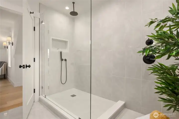 A stunning layout with Brizo designer faucets and shower system within the Primary Suite.