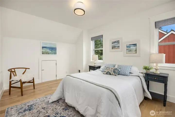 At the end of the upper hallway is a large bedroom that easily could hold two beds and includes a sweet door that could be a fun "kid camp some day"