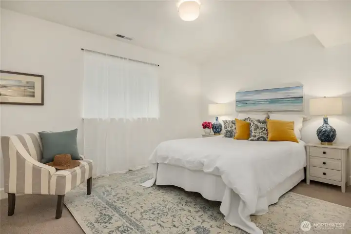 At the bottom of a another soft wool carpeted stairway from the main level and to the right is this ground level room with adjacent built-in closets and storage plus a 3/4 bath.  This floor is wool carpet.  This area could be an office or a perfect in-law suite as it can also be approached through the garage.