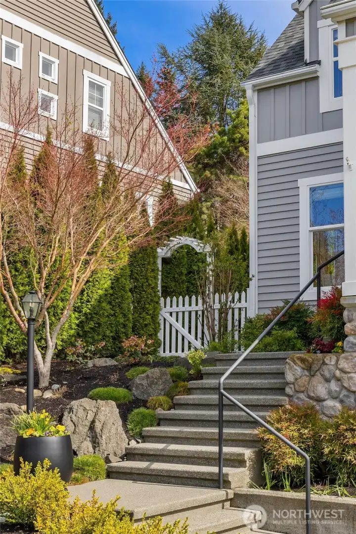Lovely gardens and the stairway leading to the front porch.