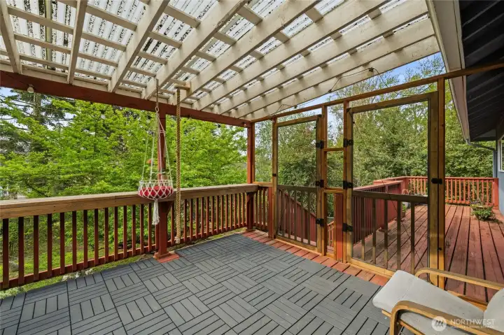 Top deck off the kitchen. Completely covered for year round comfort