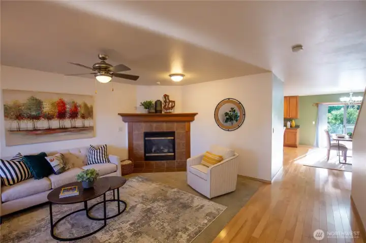 The living room flows to the dining room and kitchen.