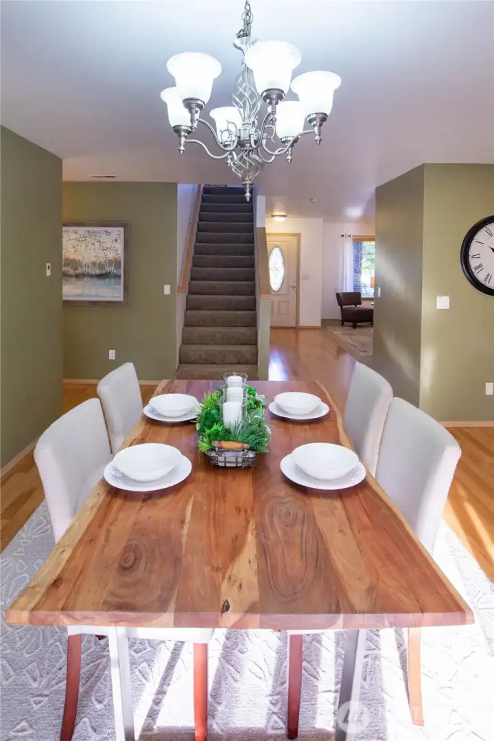 Another view of the dining room and stairs to the upper floor.