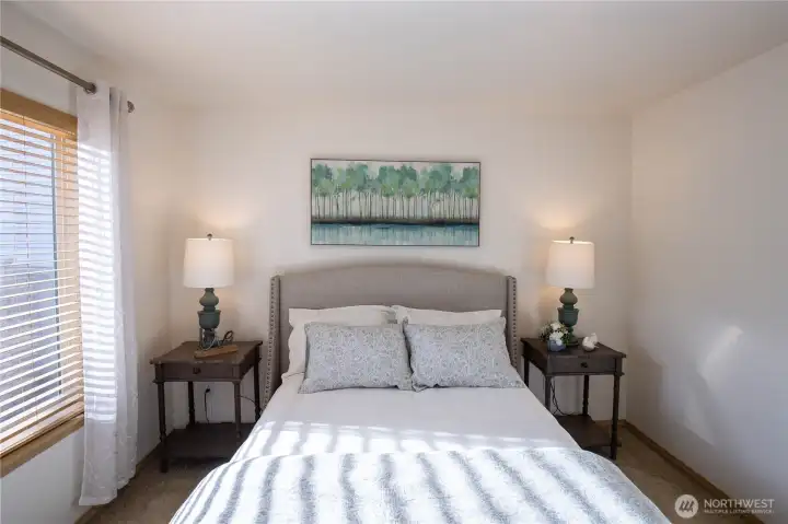 A main floor bedroom with another walk-in closet, perfect for guest room, office space or multi-gen living,