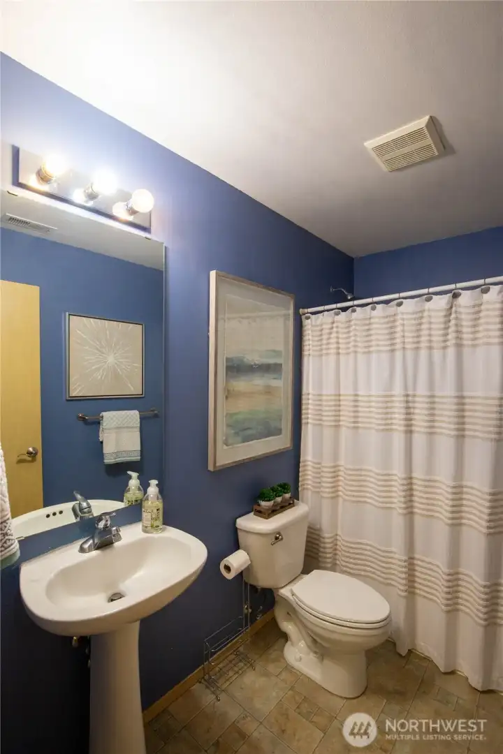 The main floor full bathroom is a bonus for located next to the main floor bedroom, perfect for guests or multi-gen living.