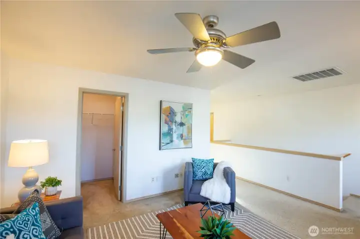 Another view of the upstairs bonus flex space with huge walk-in storage closet.