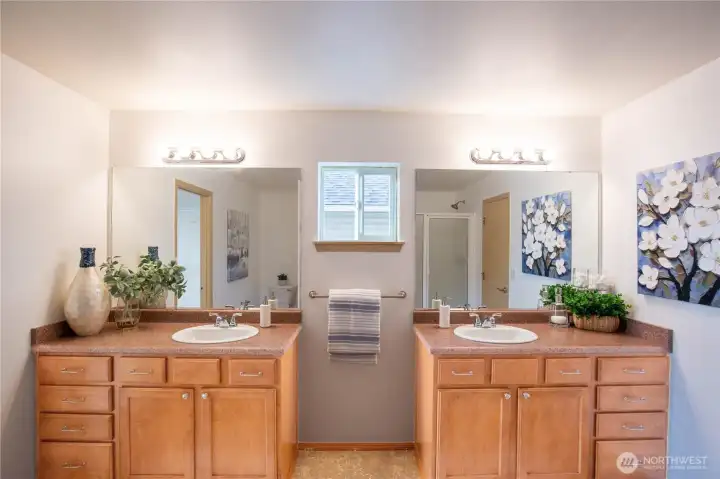 Enjoy the dual vanities with lots of cabinet space.