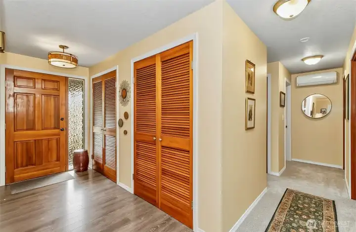 Front hallway and side hallway leading to the bedrooms, new flooring throughout Front hallway and side hallway leading to the bedrooms, new flooring throughout