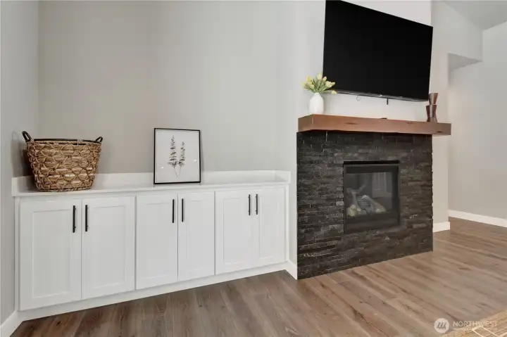Storage, fireplace and accent stone set the tone for this new construction home.