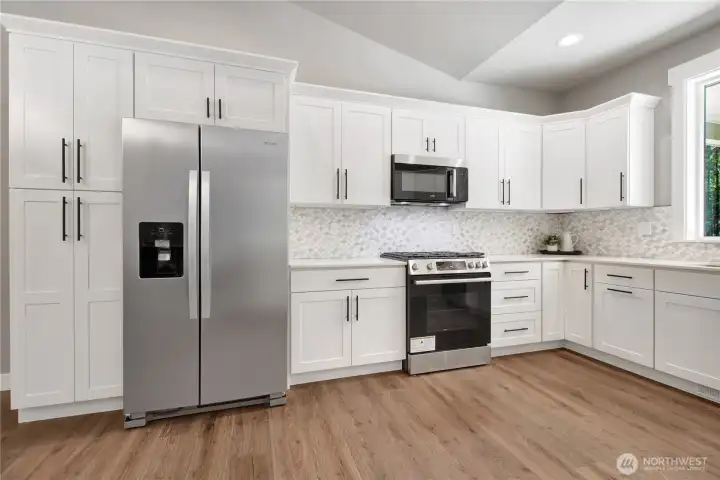 Classic shaker white cupboards and granite counter tops throughout.