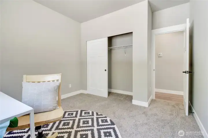second bedroom down the hall staged as a office space