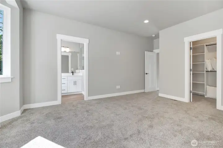 primary bedroom entry closet and bathroom space!