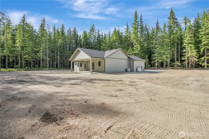 front yard and entrance to the right, with the spacious lot mostly useable with room to grow! blank slate for you to decide on where you want flower beds, grass and added gravel for parking!