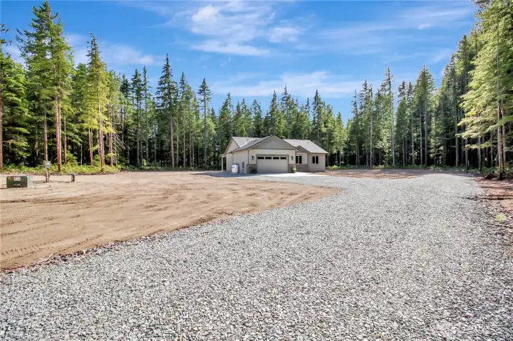 Front entry from the easement road out to the home.