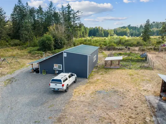 35'x42' Outbuilding currently houses a 37 ft long 5th wheel trailer that will be removed prior to closing. This space has functioned as a third dwelling. Notice the huge garden beside it? Please see the attached listing supplements and/or 3D tour for additional details and photos.