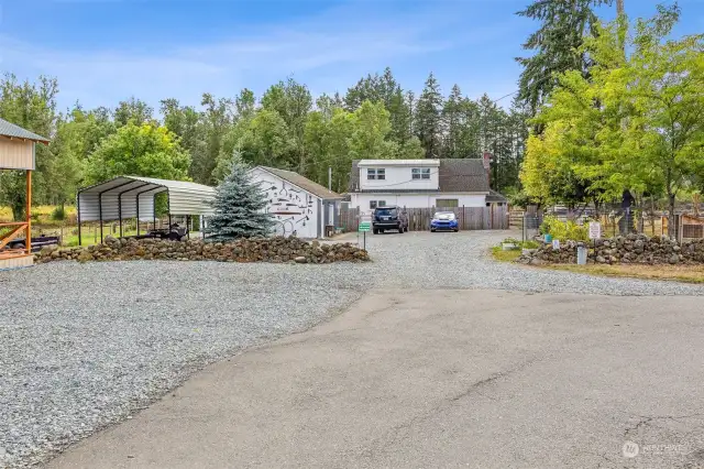 This is the view of the home from the driveway. The driveway splits off to the right here and leads to all of the other buildings, with the exception of the ADU.