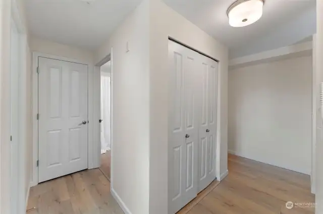 This view shows the transition from the pantry closet to the hallway where the bathroom and bedroom are