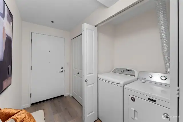 In the entry hallway is the full sized washer/dryer that stay with the sale!