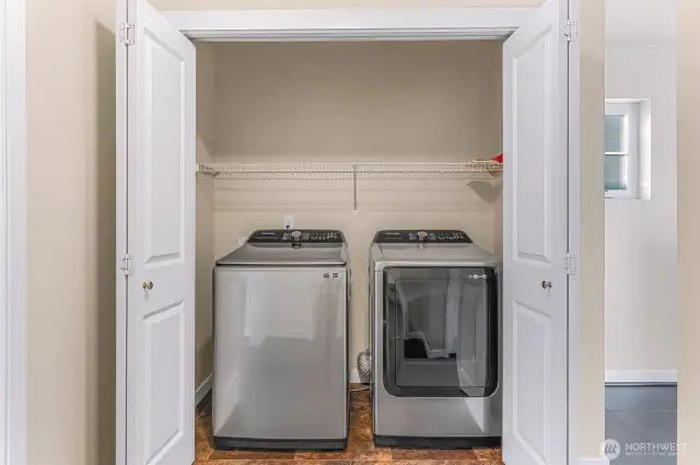 Upstairs laundry in the hall.