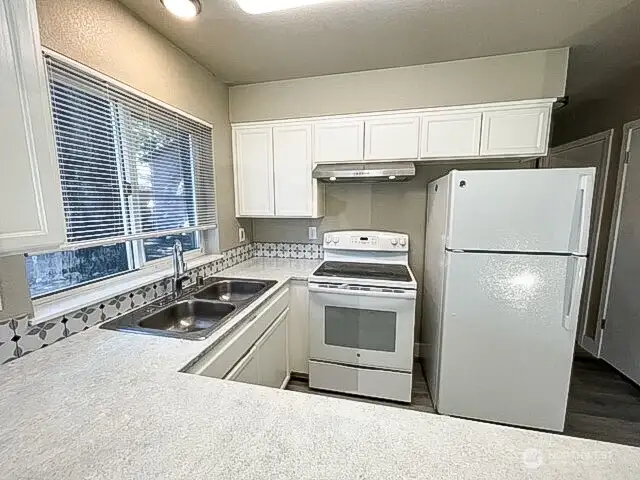 Unit A kitchen, looking stylish with newer designer paint.