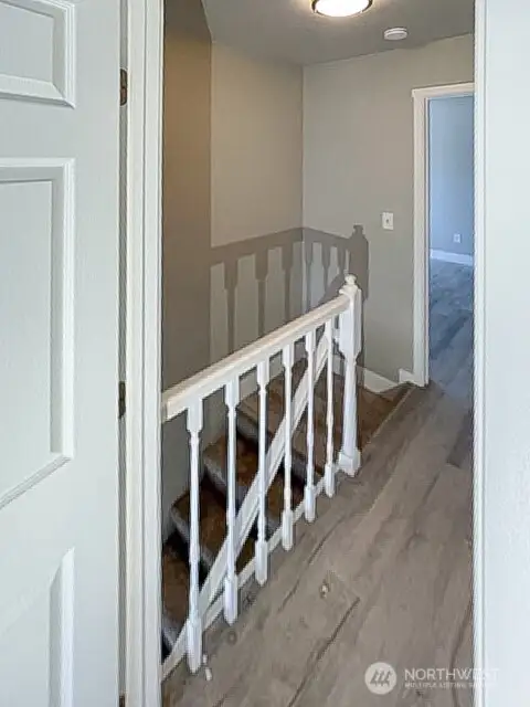 Unit A upper landing with newer flooring.