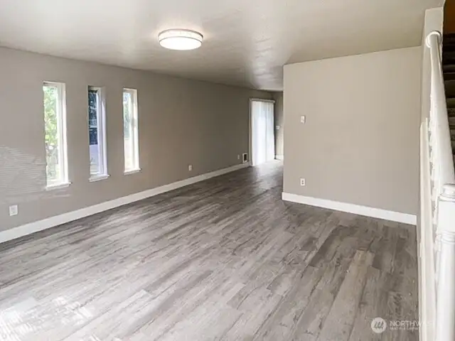 Unit A living room with newer easy-care flooring.