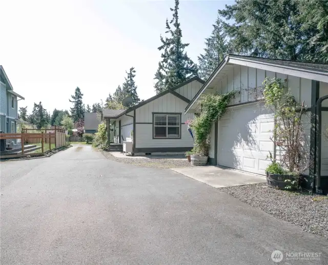 Paved driveway with easy access to home and garage.