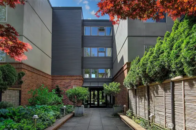 Grand and lush building entry.