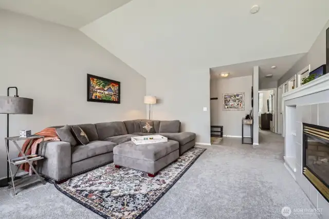 The vaulted ceilings make this space feel gigantic & the fireplace is perfect for cozy winter nights!