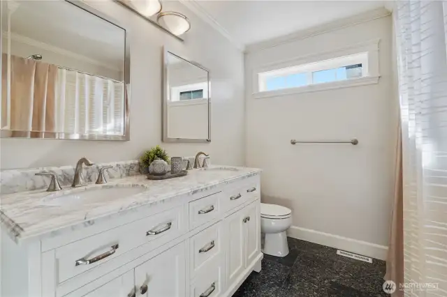Upstairs bathroom with dual vanities.