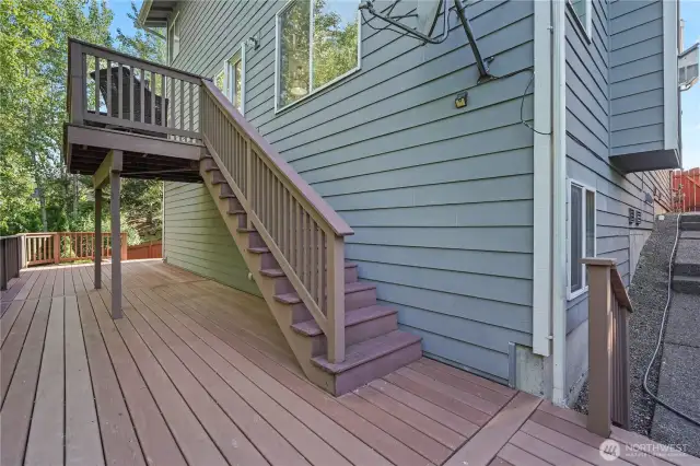 Deck off main living area to lower level deck and fenced yard.