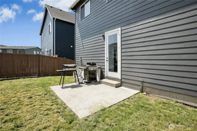 fully fenced backyard, patio off kitchen for easy bbq access