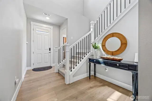 Foyer looking towards front door and 1/2 bath.