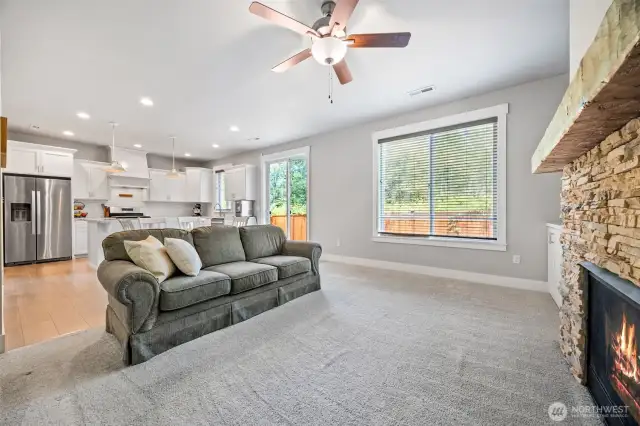 Living room open to dining and kitchen