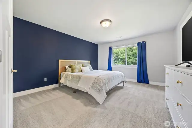 Primary bedroom with plenty of space for king bed and furniture.