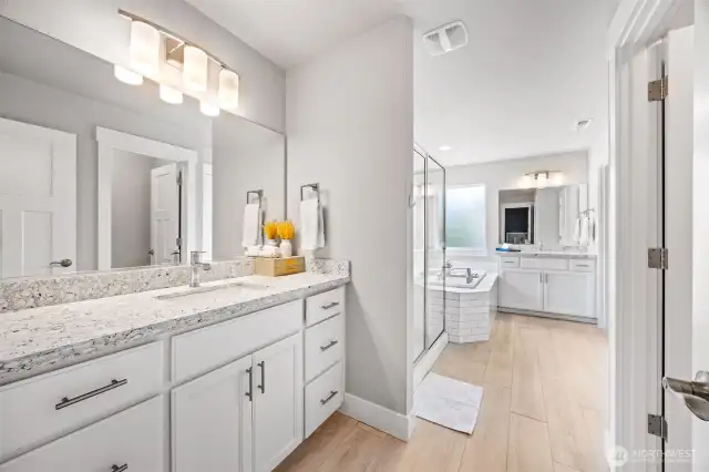 Primary 5 piece bathroom with quartz counters, glass shower. and soaking tub!