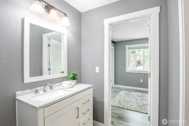 Upper floor bath with entrance to secodary bedroom.