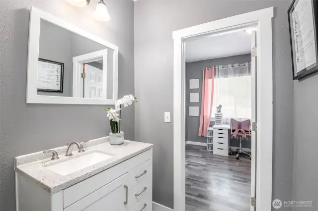 Main floor full bath services both bedrooms.